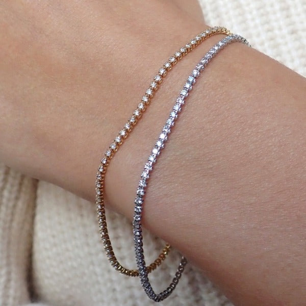 Skinny diamond tennis bracelet from Doyle & Doyle, an antique and vintage jewelry boutique.