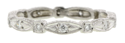 Contemporary ring: a Platinum Diamond .20ctw Eternity Band sold by Doyle & Doyle vintage and antique boutique.