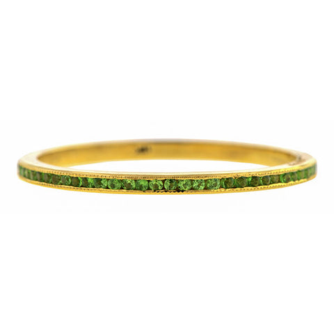 Contemporary ring; a Yellow Gold Tsavorite Wedding Eternity Band sold by Doyle & Doyle vintage and antique jewelry boutique.