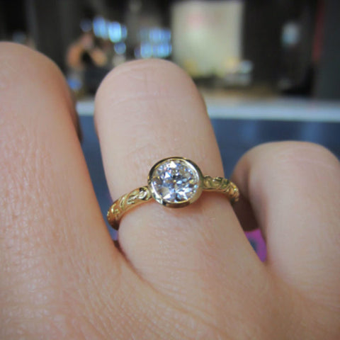 Contemporary ring: a Yellow Gold Old Euro .73ct Bezel Engagement Ring- Heirloom sold by Doyle & Doyle vintage and antique jewelry boutique.