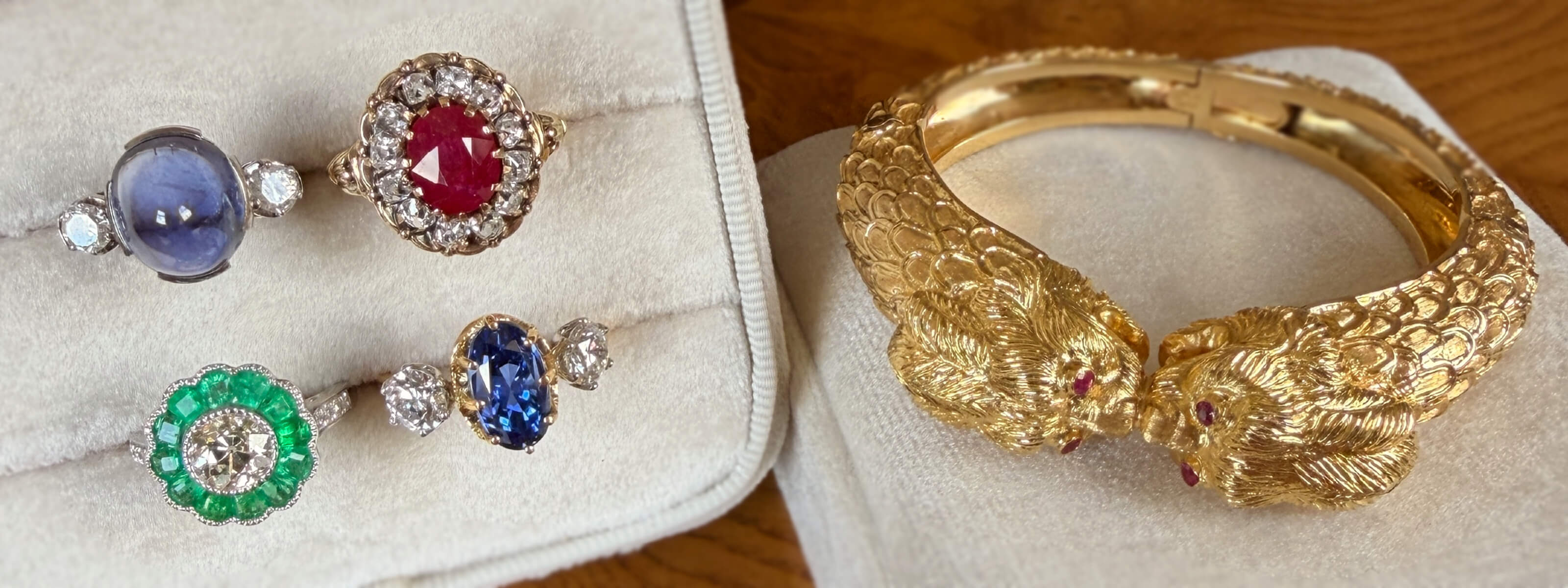 Distinct Gemstone rings featured alongside a gold bracelet