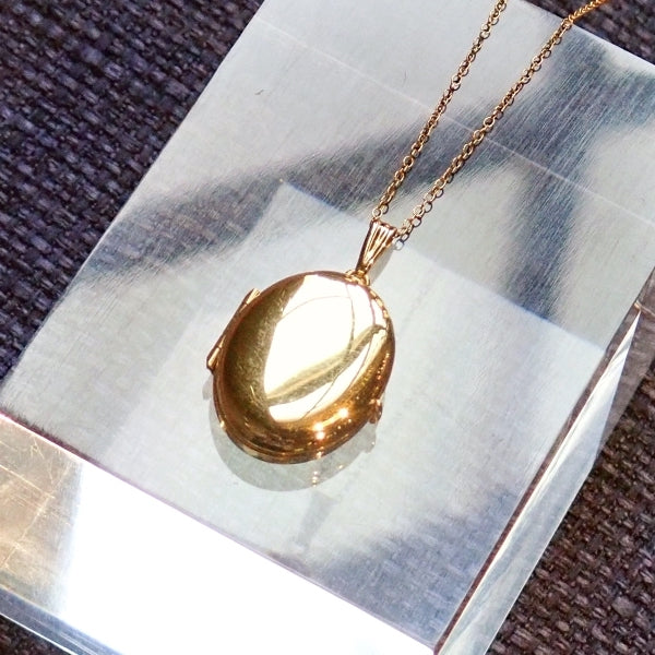 Oval Gold Locket Necklace for 4 photos, from Doyle & Doyle antique and vintage jewelry boutique