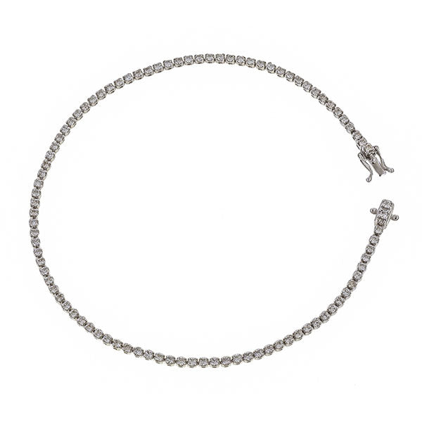 Skinny diamond tennis bracelet from Doyle & Doyle, an antique and vintage jewelry boutique.