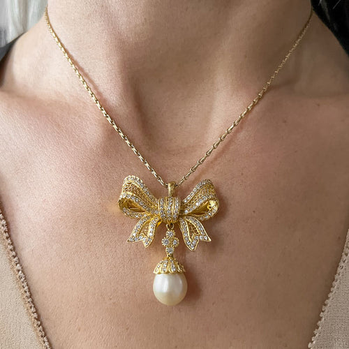 Vintage Diamond & Pearl Drop Bow Pendant sold by Doyle and Doyle an antique and vintage jewelry boutique