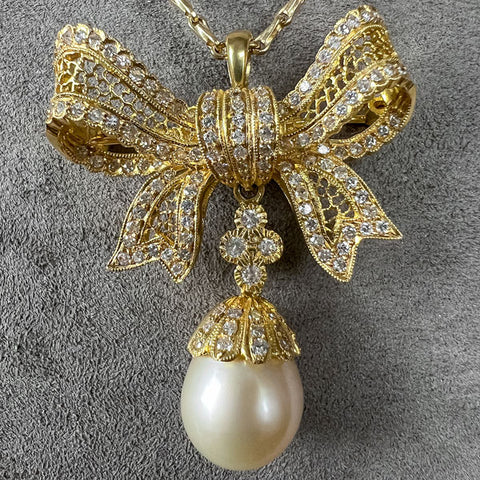 Vintage Diamond & Pearl Drop Bow Pendant sold by Doyle and Doyle an antique and vintage jewelry boutique