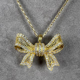 Vintage Diamond & Pearl Drop Bow Pendant sold by Doyle and Doyle an antique and vintage jewelry boutique