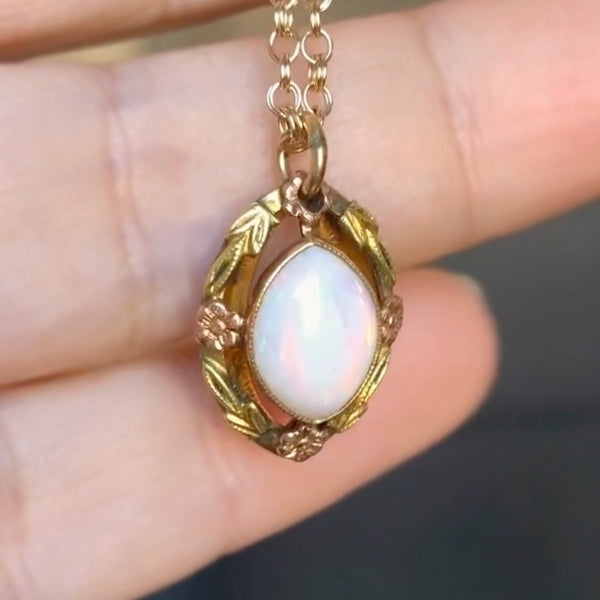 Vintage Opal Pendant with tri gold flower frame, from Doyle & Doyle antique and vintage jewelry boutique
