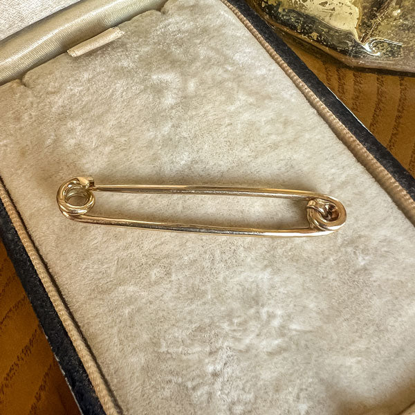 Antique Gold Safety Pin and charm holder sold by Doyle and Doyle an antique and vintage jewelry boutique