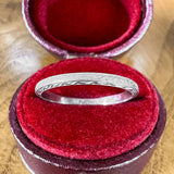 Vintage Patterned Platinum Wedding Band sold by Doyle and Doyle an antique and vintage jewelry boutique
