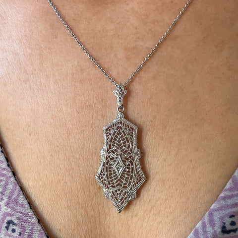 Vintage Filigree Diamond Pendant sold by Doyle and Doyle an antique and vintage jewelry boutique