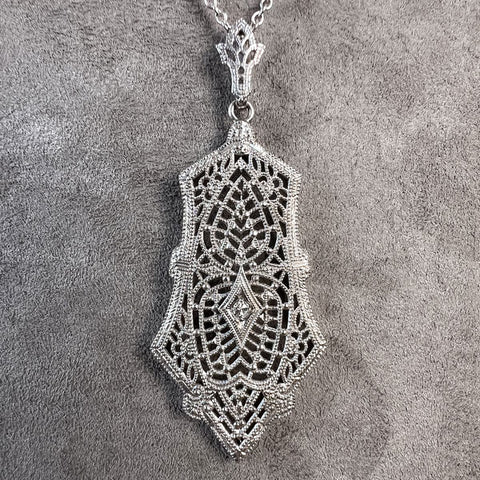 Vintage Filigree Diamond Pendant sold by Doyle and Doyle an antique and vintage jewelry boutique