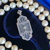 At Deco Rock Crystal Filigree Diamond Pendant, sold by Doyle & Doyle an antique and vintage jewelry boutique