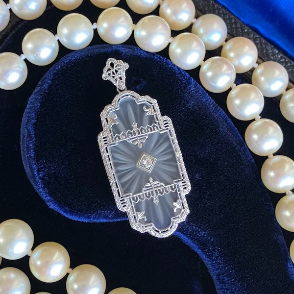 At Deco Rock Crystal Filigree Diamond Pendant, sold by Doyle & Doyle an antique and vintage jewelry boutique