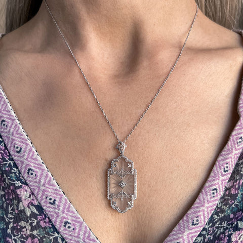 At Deco Rock Crystal Filigree Diamond Pendant sold by Doyle and Doyle an antique and vintage jewelry boutique