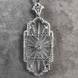At Deco Rock Crystal Filigree Diamond Pendant, sold by Doyle & Doyle an antique and vintage jewelry boutique