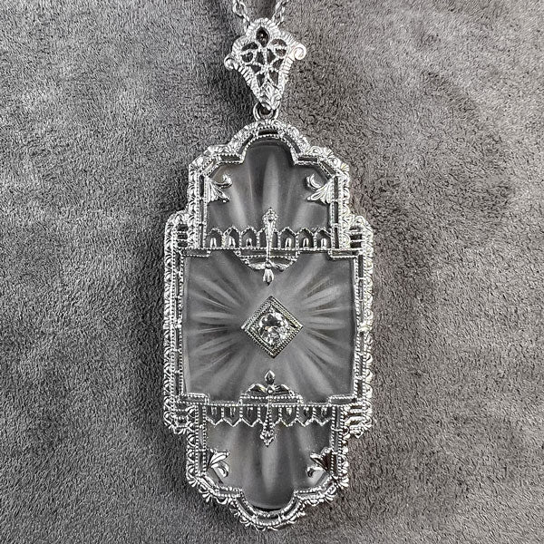 At Deco Rock Crystal Filigree Diamond Pendant, sold by Doyle & Doyle an antique and vintage jewelry boutique