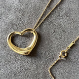 Vintage Tiffany & Co Elsa Peretti Floating Heart Pendant sold by Doyle and Doyle an antique and vintage jewelry boutique