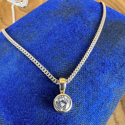 Vintage Diamond Solitaire Pendant Necklace sold by Doyle and Doyle an antique and vintage jewelry boutique 