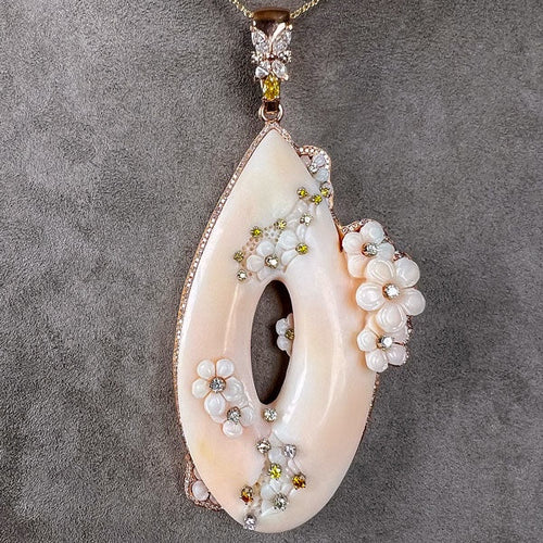 Carved Coral & Diamond Pendant sold by Doyle and Doyle an antique and vintage jewelry boutique