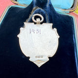 Vintage Silver Track & Field Medal, 1931 sold by Doyle and Doyle an antique and vintage jewelry boutique
