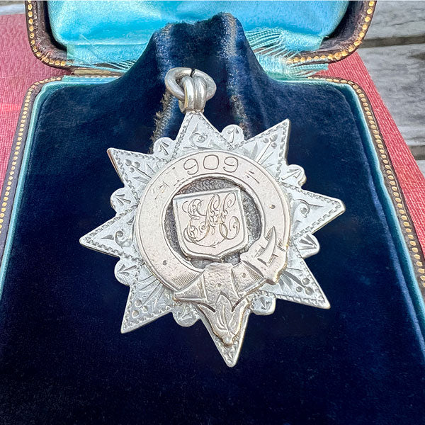Antique Edwardian Silver Fancy Medallion Fob, 1909 sold by Doyle and Doyle an antique and vintage jewelry boutique