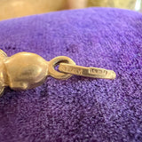 Vintage Buddha Pendant sold by Doyle and Doyle an antique and vintage jewelry boutique