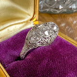 Vintage Filigree Three Stone Engagement Ring, Old Euro. 0.35ct sold by Doyle and Doyle an antique and vintage jewelry boutique