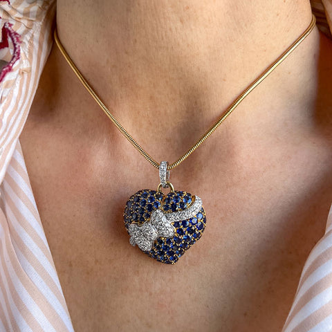 Vintage Sapphire & Diamond Heart & Bow Pendant sold by Doyle and Doyle an antique and vintage jewelry boutique