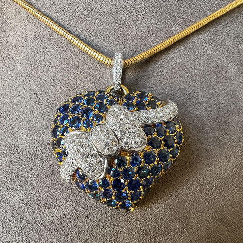 Vintage Sapphire & Diamond Heart & Bow Pendant sold by Doyle and Doyle an antique and vintage jewelry boutique