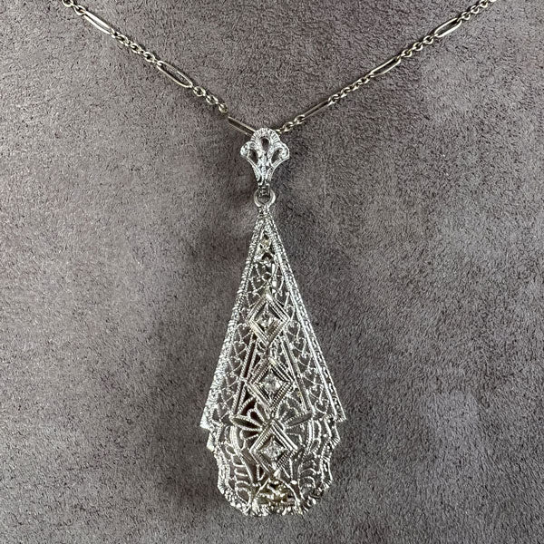 Vintage Filigree Diamond Pendant/ Brooch sold by Doyle and Doyle an antique and vintage jewelry boutique