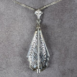 Vintage Filigree Diamond Pendant/ Brooch sold by Doyle and Doyle an antique and vintage jewelry boutique