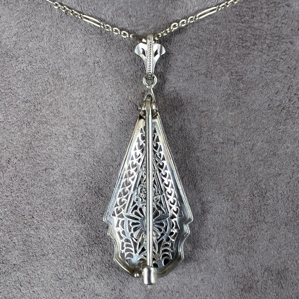 Vintage Filigree Diamond Pendant/ Brooch sold by Doyle and Doyle an antique and vintage jewelry boutique