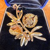 Vintage Ruby & Diamond Opening Seed Pod Pin in yellow gold, sold by Doyle & Doyle antique and vintage jewelry boutique