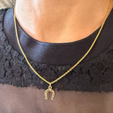 Vintage Gold Horseshoe Pendant sold by Doyle and Doyle an antique and vintage jewelry boutique