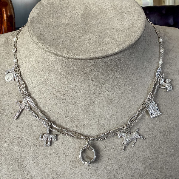 Art Deco Diamond Charm Necklace sold by Doyle and Doyle an antique and vintage jewelry boutique
