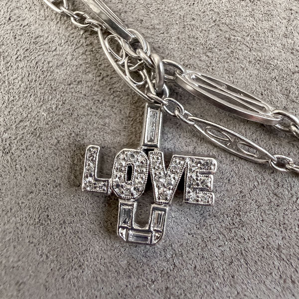 Art Deco Diamond Charm Necklace sold by Doyle and Doyle an antique and vintage jewelry boutique