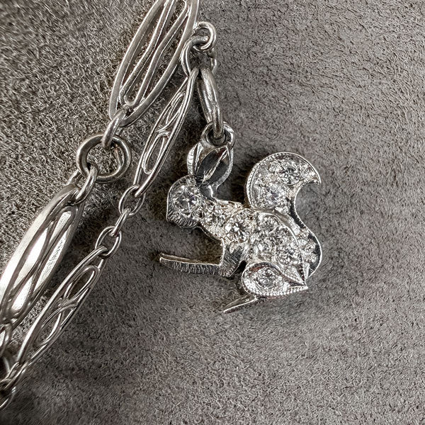 Art Deco Diamond Charm Necklace sold by Doyle and Doyle an antique and vintage jewelry boutique