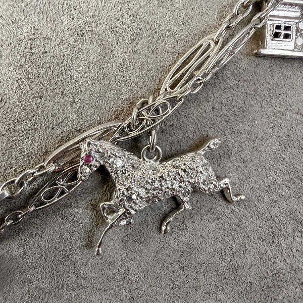 Art Deco Diamond Charm Necklace sold by Doyle and Doyle an antique and vintage jewelry boutique