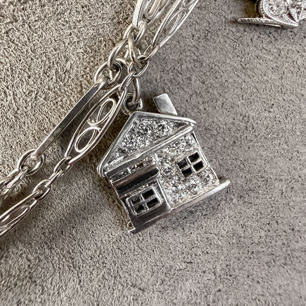 Art Deco Diamond Charm Necklace sold by Doyle and Doyle an antique and vintage jewelry boutique