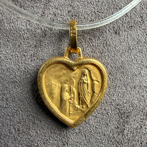 Vintage Virgin Mary Heart Shaped Pendant sold by Doyle and Doyle an antique and vintage jewelry boutique