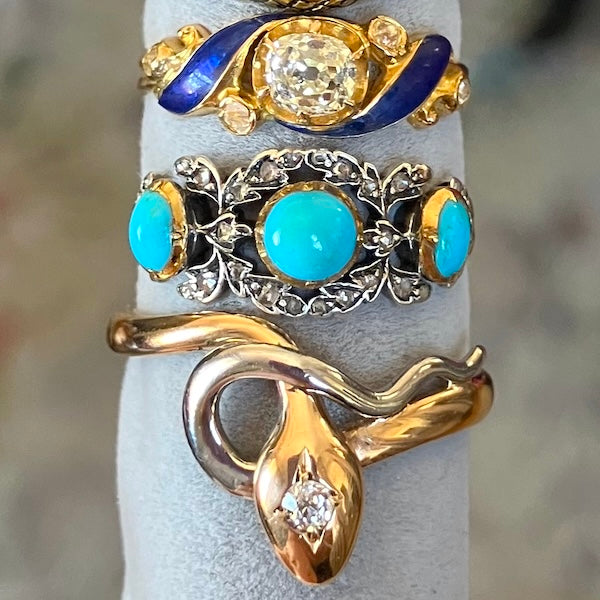 Three antique gold rings set with turquoise, diamonds, and enamel, from Doyle & Doyle antique and vintage jewelry boutique