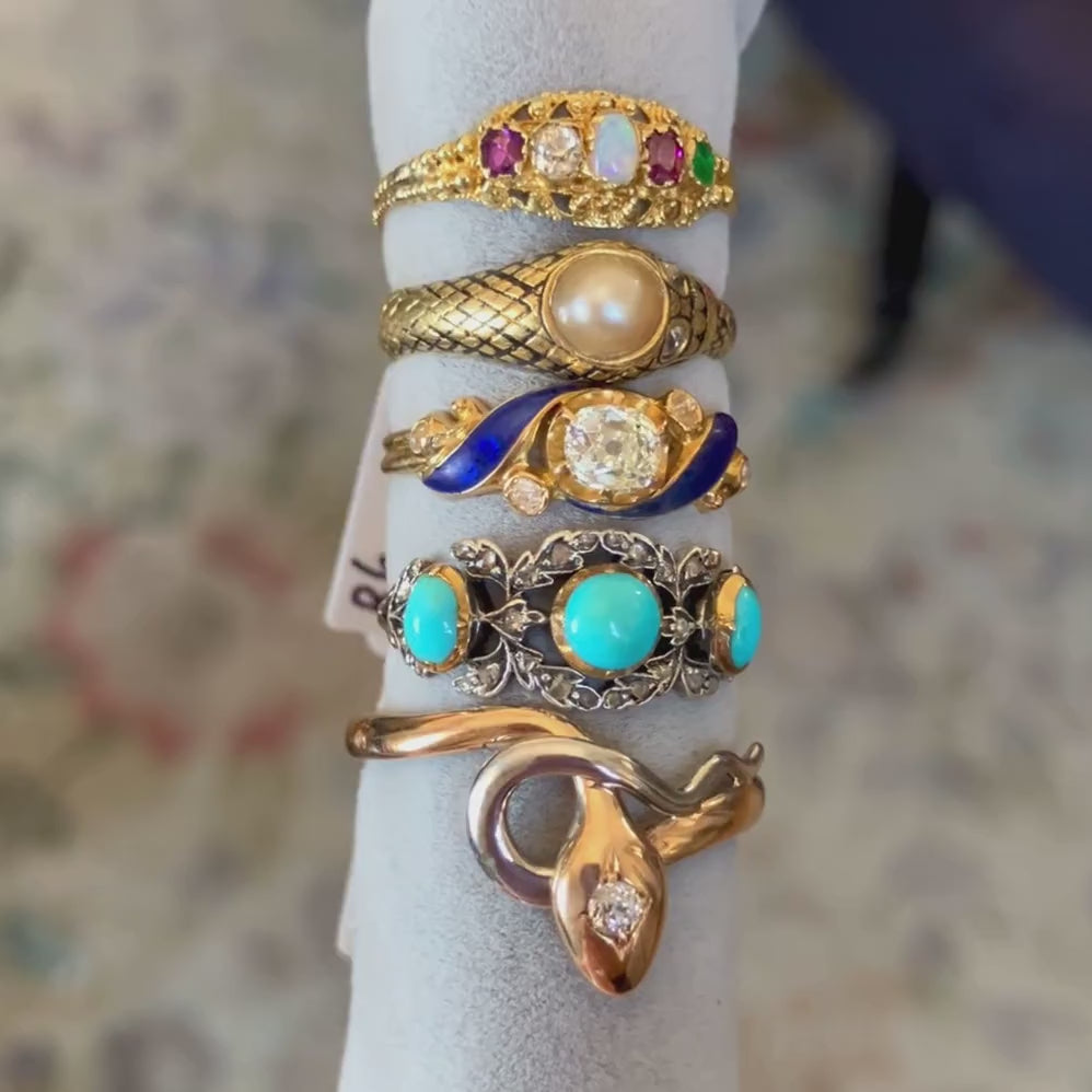 Five antique gold rings set with gemstones, diamonds, pearl, and enamel, from Doyle & Doyle antique and vintage jewelry boutique