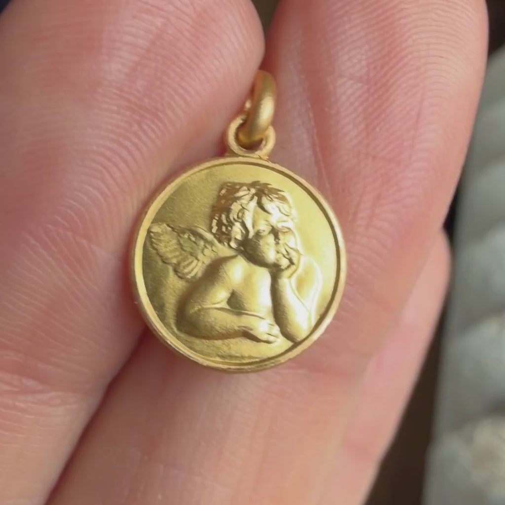 Vintage Cherub Pendant sold by Doyle and Doyle an antique and vintage jewelry boutique