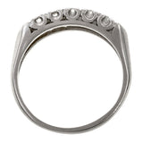 Vintage ring: a Platinum Wedding Band With Round Brilliant Cut Diamonds sold by Doyle & Doyle vintage and antique jewelry boutique.