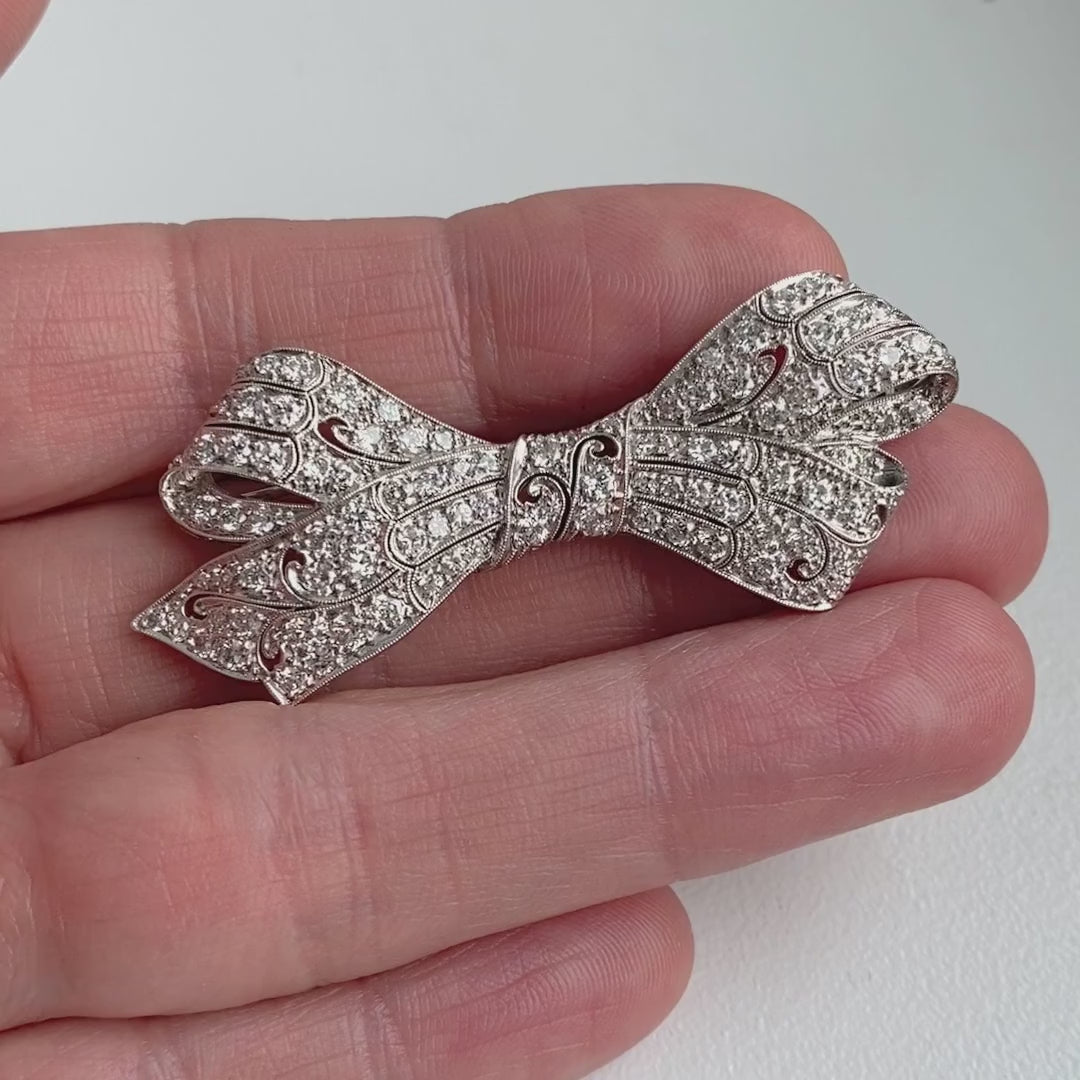 Art Deco Diamond Bow sold by Doyle and Doyle an antique and vintage jewelry boutique