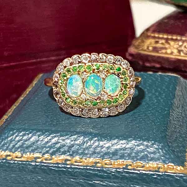 Edwardian Opal, Demantoid & Diamond Ring sold by Doyle and Doyle an antique and vintage jewelry boutique