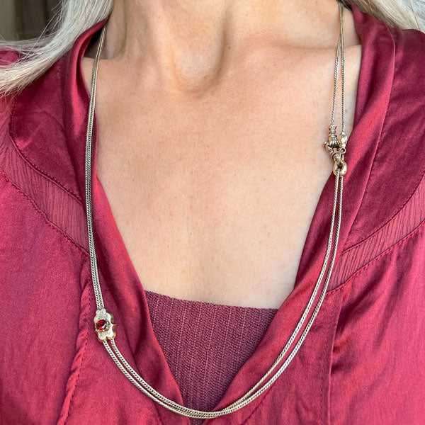 Victorian Long Chain with Garnet Slide sold by Doyle and Doyle an antique and vintage jewelry boutique
