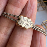 Victorian Long Chain with Garnet Slide sold by Doyle and Doyle an antique and vintage jewelry boutique