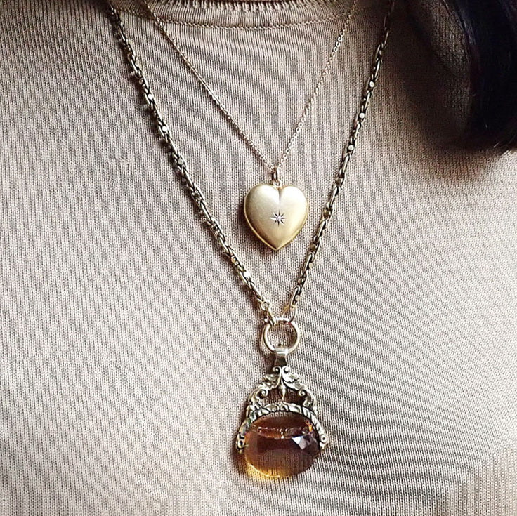 Antique Locket: Heart Shaped Diamond Locket, sold by Doyle & Doyle an antique and vintage jewelry store.
