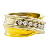 Vintage ring: a Yellow & White Two-tone Gold Diamond Crossover Wedding Band sold by Doyle & Doyle vintage and antique jewelry boutique.